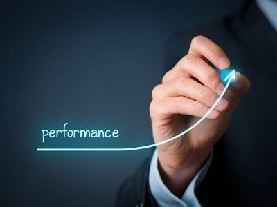 A businessman sketches "performance" on a transparent screen.